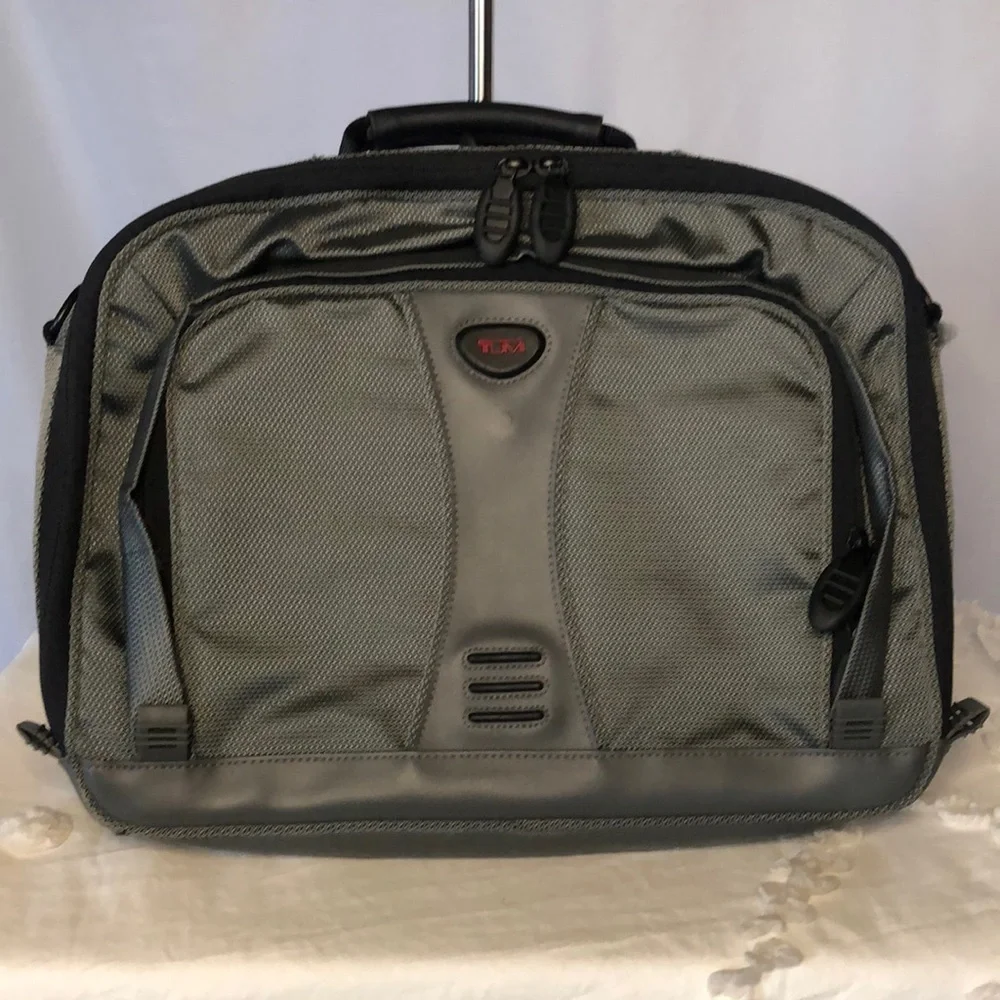 TUMI gray soft case laptop bag/case. Mesh front. Multiple sections.
